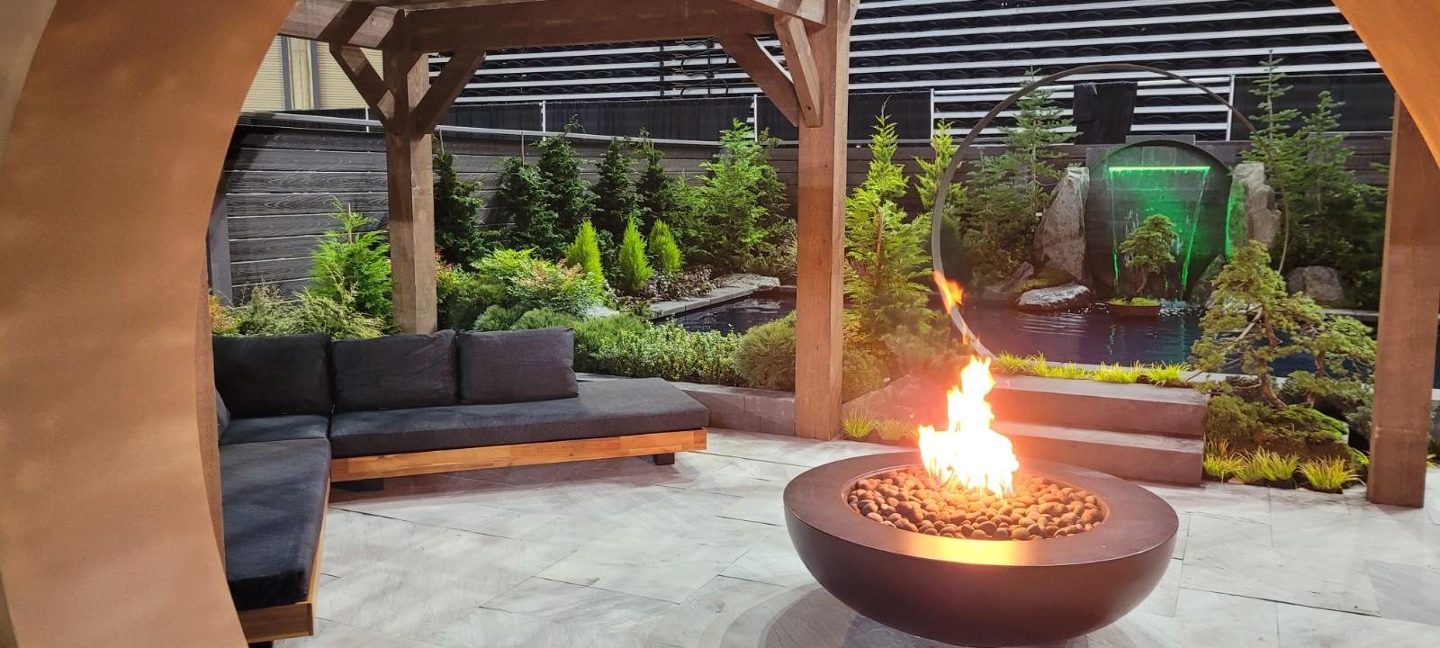 Covered outdoor lounge with a fire bowl