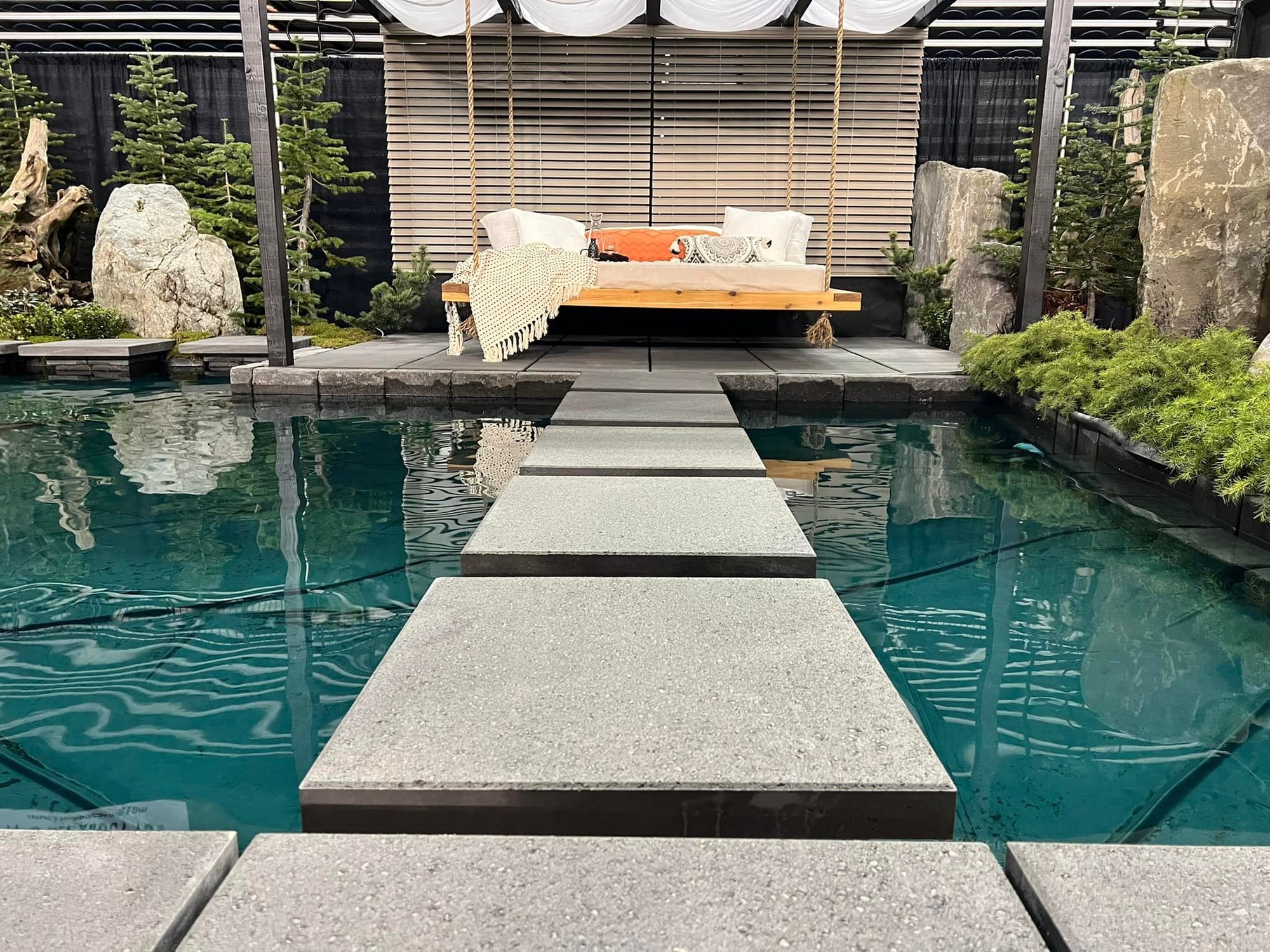 Pool hardscape with stepping stones and stone patio detailing